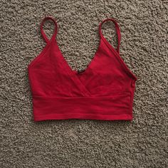 Brandy Red Tank Never Worn Soft Material Doesnt Sell Anymore Red Cotton V-neck Crop Top, Trendy Red V-neck Tank Top, Red V-neck Crop Top For Spring, Spring Red V-neck Crop Top, Red V-neck Cotton Crop Top, Red Fitted V-neck Crop Top, Trendy Red V-neck Crop Top, Red Tank, Brandy Melville Tops