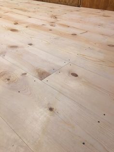 an unfinished wooden floor is shown in this image