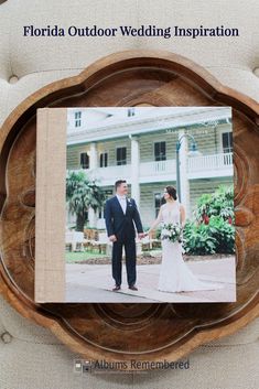 a wedding album on a wooden plate with the words, wedding album of the week