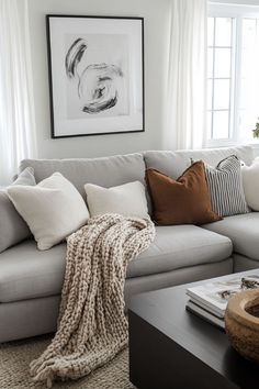 a living room filled with furniture and pillows