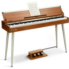 an electronic piano sitting on top of a wooden stand