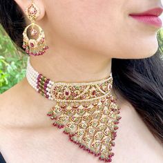 Featured is a traditional bridal choker set, ideally suited for bridal functions. The necklace weighs 69.2 gms including 19.68 gms in the hanging and stringing beads The earrings weigh 15.57 gms including 2.36 gms in the hanging ruby emerald beads. Price Breakup Summary Component Rupees % of Total 22k Gold 375,365 76.0% Stones & Beads 36,394 7.4% Making Charges 67,566 13.7% Taxes (GST) 14,380 3.0% Total 493,704 100.0% View Detailed Price Breakup Watch Video Here Jadau Choker Set, Jadau Choker, Bridal Choker Set, 22k Gold Jewelry Necklaces, Stringing Beads, 22k Gold Jewelry, Bridal Choker, Pearl Necklace Set, 22 Carat Gold