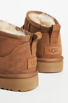 The UGG® Classic Ultra Mini is crafted from sheepskin with a flexible, ultra-lightweight sole. It's one of the most coveted classics, offering built-in flair and easy on-off wear. | Classic Ultra Mini Boots by UGG in Yellow, Women's, Size: 10, Rubber at Anthropologie Low Rise Uggs, Ugh Mini, Ugh Ultra Mini, Uggs Boots, Platform Uggs, Tiny Ugg Boots, Mini Uggs, Uggs Classic Mini, Nike Winter Jackets