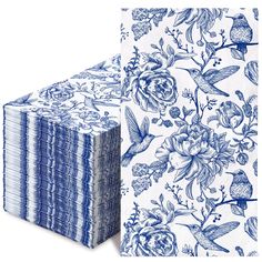 a stack of blue and white napkins next to each other on a white background