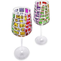 two wine glasses with different colored designs on them