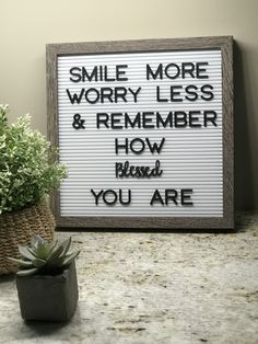 a sign that says smile more worry less and remember how messed you are with succulents