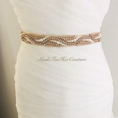 Please choose your ribbon color from the drop down menu. Add glamour to your wedding dress with this gold rhinestone pearl heirloom bridal sash belt. The sash is embellished with high quality glass crystals. The satin sash ribbon is approximately 3.5 yards long. The ribbon is available in many other colors. Measurements: Ribbon is available in two different widths: 5/8 inch 1.5 inches Embellishment is approximately 1 inches wide at the widest point and available in different lengths. Processing: Elegant Gold Bridal Accessories With Sashes, Elegant Gold Sashes With Embroidered Belt, Gold Embroidered Bridal Belt For Wedding, Elegant Gold Bridal Belt For Bride, Elegant Embellished Party Sash, Elegant Gold Bridal Belt, Elegant Gold Belts, Elegant Bridal Belt With Sashes For Bride, Elegant Gold Bridal Belt With Sashes