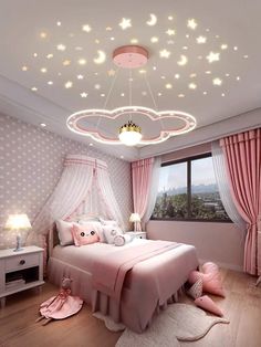 a bedroom with pink bedding and stars on the ceiling, lights above the bed