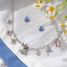 Don't be late! Make your way down the rabbit hole with our Disney Alice in Wonderland Charm Necklace. This 16-19" silver charm necklace features a collection of iconic charms inspired by the beloved tale, like Alice, Cheshire Cat, White Rabbit, and more. Let the magic of Wonderland accompany you on your next adventure embrace the whimsical world of Wonderland wherever you go! Alice Cheshire Cat, Lost In Wonderland, Disney Alice In Wonderland, Silver Charm Necklace, Cat White, Yellow Hoodie, Down The Rabbit Hole, Origami Owl Jewelry, The Rabbit Hole