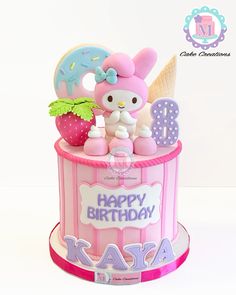 a hello kitty birthday cake with an ice cream cone