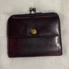 Classic Design All Leather Coach Wallet. Color Is A Very Dark Burgundy Maroon. Many Signs Of Wear Throughout, Minor Scratches And Scrapes, But It Does Not Take Away From The Value And Functionality Of This Coinpurse. Please See Pictures. Darkening From Use Just Adds To The Vintage Beauty Of This Wallet. Classic Bifold Coin Purse With Removable Pouch, Classic Coin Purse With Interior Card Slots, Elegant Coin Purse With Snap Closure For Everyday, Classic Coach Coin Purse With Coin Pocket, Classic Coach Coin Purse Gift, Classic Coach Coin Purse As Gift, Coach Rectangular Wallet With Snap Closure, Coach Wallets With Removable Pouch For Formal Use, Elegant Brown Coach Coin Purse