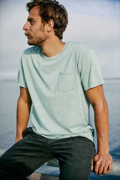 Casual Washed Black T-shirt, Faded Pre-washed Cotton T-shirt, Casual T-shirt With Side Pockets For Summer, Washed Short Sleeve Organic Cotton T-shirt, Short Sleeve Washed Organic Cotton T-shirt, Light Wash Relaxed Fit T-shirt For Everyday, Casual Green T-shirt With Side Pockets, Relaxed Washed Cotton Tops, Casual Washed Blue T-shirt