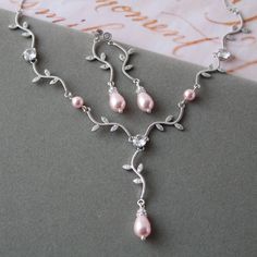 Elegant Silver Dangle Jewelry Sets, Delicate Silver Jewelry Sets For Formal Occasions, Silver Hand Set Dangle Jewelry Sets, Silver Jewelry Sets With Hand-set Dangle, Pink Bridal Necklace With Matching Earrings For Wedding, Silver Dangle Jewelry Sets For Anniversary, Elegant Silver Bridal Sets For Mother Of The Bride, Delicate Silver Crystal Bridal Earrings, Delicate Silver Round Bridal Earrings