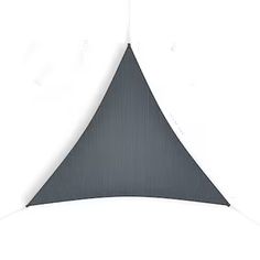 a black and white photo of a triangular shaped object hanging from a string on a wall