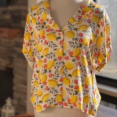 This Top Is So Cute - Flowy Button Down Is Both Comfy And Stylish. 100% Rayon Yellow Beach Top With Buttons, Yellow Button-up Blouse For Vacation, Yellow V-neck Summer Shirt, Yellow Vacation Top With Button Closure, Yellow Buttoned Vacation Top, Yellow Button-up Vacation Tops, Yellow Button-up Top For Vacation, Yellow Relaxed Fit Blouse For Vacation, Yellow Relaxed Fit Blouse With Buttons