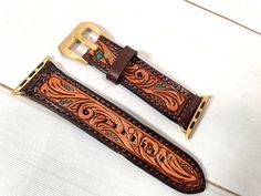 Leather tooled 1” wide watch band with satin gold buckle compatible with 38, 40, 41mm Apple Watches Adjustable from 5.25” to 7” tooled and hand painted made by American Darling, not customizable Western Watch Band, Tooled Leather Watch Bands, Tack Sets, Apple Watches, Leather Watch Band, Saddle Pads, Purse Strap, Leather Watch Bands, Christmas 2024