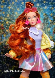 a barbie doll with long red hair wearing a dress and yellow boots, standing in front of a floral background