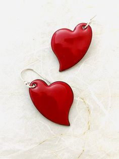 Heart Earrings ~ Red Enamel Minimalist Asymmetrical Heart Drop Earrings A perfect gift for the one you love! And if that's you, that's great!! Red enamel heart measures 1 inch in height. Copper heart with fused enamel. Made with Sterling silver earwires. Handle as glass. Handmade in the Pacific Northwest ❤️ Nickel Free Red Earrings For Valentine's Day, Red Dangle Earrings For Everyday, Red Dangle Earrings For Everyday Wear, Red Sterling Silver Earrings For Everyday, Red Hypoallergenic Earrings For Everyday Wear, Red Double Heart Earrings For Gift, Red Everyday Earrings, Red Double Heart Pierced Earrings, Red Double Heart Earrings As Gift