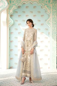 Luxury Party Wear in Ivory Color in Stylish design presented with beautiful embroidery work and looking unique. Buy luxury party wear online in USA. Elegant Lawn Suit With Dabka For Wedding, Elegant Lawn Suit With Dabka For Reception, White Naqshi Anarkali Set For Wedding, White Anarkali With Naqshi Detailing, Elegant Festive Gown With Naqshi Detailing, Elegant Party Lehenga With Naqshi Details, Elegant Gown With Naqshi For Reception, Festive Elegant Gown With Naqshi, Elegant Reception Gown With Naqshi Detailing