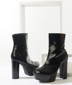 Make your attitude known in these stunning boots from Unique Vintage, crafted in shiny textured black leatherette and boasting a marvelous 2 inch platform and 5 inch block heel. An inner side zipper provides secure wear while the cushion insole lends comfortable wear! Edgy Platform Boots With Reinforced Heel, Medium Width, Leather Ankle-high Platform Boots With Sculpted Heel, Calf Leather Ankle-high Platform Boots With Reinforced Heel, Ankle-high Leather Platform Boots With Reinforced Heel, Black Ankle-high Platform Boots With Sculpted Heel, Black Platform Heels, Black Platform, Side Zipper, Heeled Ankle Boots