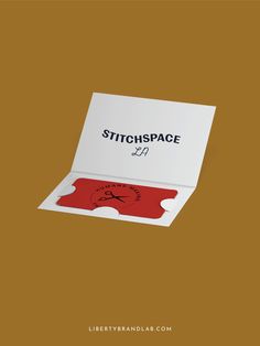 a red and white box with a sticker on it that says, stitchspace