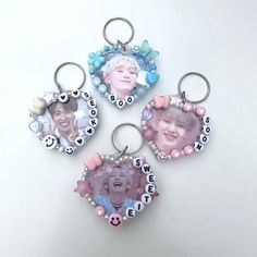 three key chains with pictures of people on them