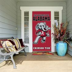 the front porch with two chairs and an elephant door sign