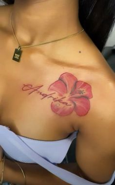 a woman with a flower tattoo on her chest