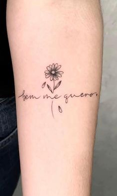 a person with a flower tattoo on their arm