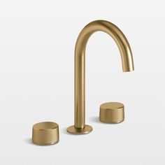 a gold faucet with two brass knobs on the side and an empty one