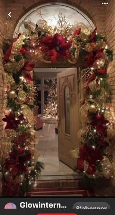 a door decorated with red and gold christmas decorations