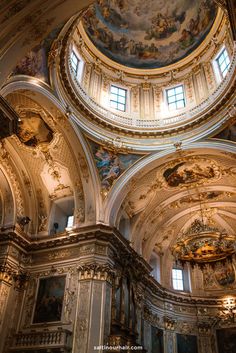 the interior of an old church with painted ceilings