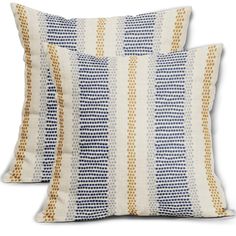 two blue and yellow pillows on a white background