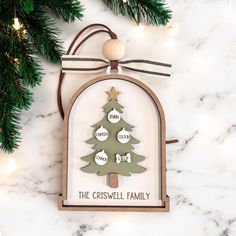 a christmas tree ornament hanging on a wall