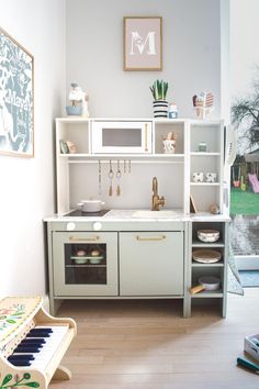 the kitchen is clean and ready to be used for cooking or playing music on the piano