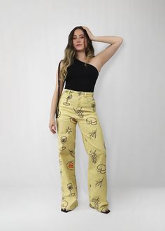 The iconic Cocktail Hour Pants, with a trendy yellow hue and playful sketches of cocktail hour snacks and drinks. Crafted from stretch material for a comfortable feel, these high waisted pants are a statement with an effortlessly cool vibe. *FINAL SALE ITEM* Material & Care: Made with a blend of 97% cotton and 3% spandex, offering a comfortable stretch and soft feel. Machine wash cold with like colors on a gentle cycle. Tumble dry low and cool iron if necessary. Avoid dry cleaning. Size & Fit: O Yellow Printed Cotton Bottoms, Printed Yellow Cotton Bottoms, Yellow Graphic Print Cotton Bottoms, Yellow Cotton Bottoms With Graphic Print, Trendy Yellow Straight Leg Bottoms, Trendy Yellow Straight Leg Pants, Printed Yellow Pants For Spring, Spring Yellow Printed Pants, Trendy High Waist Bottoms With Graphic Print