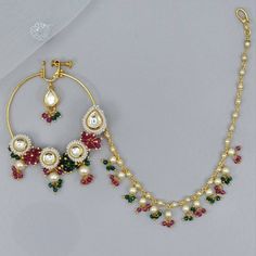 Look stunning with this gorgeous gold Kundan Bridal Nath/ Nose Ring with chain.  Enhace your either Modern or Traditional Bridal look.   Dimension:  inner diameter is 5cm and outer length 6cm approx. We try to take photos as naturally as we can, but color can be slightly vary due to lighting.  Jewelry Care -- Keep all the jewelry away from water, perfumes, and other harsh chemicals Please note: No Returns No Exchange. But If you have any issue with your order, Kindly contact us before leaving a review Nose Ring With Chain, Traditional Bridal Look, Bridal Nath, Ring With Chain, Nath Nose Ring, Bridal Nose Ring, Pakistani Jewellery, Pierced Nose, Bridal Jewelry Sets Brides