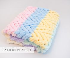 three different colored mop cloths stacked on top of each other with the words pattern blanket below them