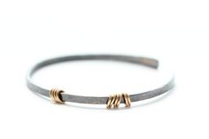 Sterling silver bracelet with 14k gold rings – Elle Naz Jewelry Minimalist Adjustable Oxidized Bracelets, Hand Forged Adjustable Minimalist Bracelet, Handmade Fine Jewelry, Oxidised Jewellery, Minimal Jewelry, Stackable Bracelets, 14k Gold Ring, Bracelet Stack, Adjustable Bracelet