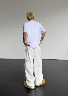 Model is 5ft 9''(176cm) tall, 145 lbs(66kg) weight and wearing a size L168cm 59kg wearing a size M - Tooling cargo- Adjustable waist- Side pockets- Straight fit- 5 colors White Full-length Cargo Jeans With Pockets, White Cargo Pocket Trousers, White Parachute Pants With Hip Pockets For Streetwear, White Cotton Pants With Cargo Pockets, White Casual Cargo Pants, Full Length White Cotton Cargo Jeans, White Cotton Bottoms With Cargo Pockets, White Parachute Pants With Multiple Pockets For Streetwear, White Parachute Pants With Multiple Pockets