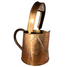 an old metal watering can with a handle