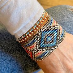 A trifecta of diamonds Flat woven beaded bracelet band; 1-1/2"w; glass seed beads; 14K rose gold-filled clasp & 1" extender chain. Great solo or stacked. Bracelet Size Guide Southwestern Beaded Bangle Bracelets, Southwestern Beaded Bangle Bracelet, Southwestern Style Multicolor Beaded Cuff Bracelet, Southwestern Hand-strung Beaded Bracelet For Beach, Southwestern Style Hand-strung Bracelets With Round Beads, Weaving Loom Diy, Red Peach, Beaded Cuff Bracelet, Weaving Loom