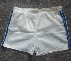 Vintage Adidas short shorts with lining and one pocket. Absolute classics Are tired so grunge style(see holes and repair on the picture) Size M Full length 35 cm In seam length 13 cm Waist 48 cm(flat measurement, round X2) Retro White Shorts With Pockets, White 90s Style Shorts For Summer, White 90s Style Summer Shorts, Vintage White Cotton Shorts, Short Adidas, Adidas Short, Adidas Vintage, Adidas Shorts, Grunge Style