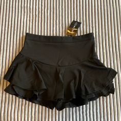 Black / Ruffles / Shorts Under That Also Have Ruffles / Never Worn / Spandex Like Material / Very Comfy Black High Waist Tennis Skirt For Summer, Casual Party Skort In Elastane, Casual Elastane Skort For Party, Stretch Skort With Built-in Shorts For Night Out, Elastane Mini Skirt In Solid Color, Summer Elastane Skort For Night Out, Summer Black Mini Skirt With Wide Waistband, Black Mini Skirt With Wide Waistband For Summer, Trendy Black Stretch Tennis Skirt