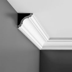 a black and white photo of a bathroom with the ceiling painted in dark gray tones