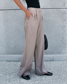 Elevate your wardrobe with these professional trousers! They are available in TWO colors: Neutral Beige & Grey. Expertly crafted with a blend of polyester, rayon, and spandex, the On Your Way Neutral Beige Pleated Trousers offer a comfortable and stylish fit. The elastic back waist, hook and eye zip closure, belt loops, and side pockets provide convenience and functionality. Style with a chic blouse, strappy hight heels, elevated gold jewelry, and a matching crossbody bag for a trendy office-rea Versatile Spring Office Dress Pants, Versatile Formal Dress Pants For Spring, Non-stretch Wide Leg Work Pants For Business Casual, Versatile Tailored Full-length Dress Pants, Tailored Full Length Versatile Pants, Tailored Full-length Versatile Pants, Office Dress Pants With Pockets, Versatile Formal Dress Pants, Non-stretch Office Pants