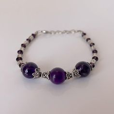 Fashionable Purple Beats With Silver Tone Bracelet. New Condition. Spiritual Silver Jewelry With Extender, Adjustable Silver Amethyst Bracelets, Silver Amethyst Beaded Bracelets, Elegant Silver Amethyst Beaded Bracelets, Silver Amethyst Bracelets With Round Beads, Silver Round Beaded Bracelets With Extender, Silver Round Beaded Bracelet With Extender, Handmade Ankle Bracelets, Penny Bracelet