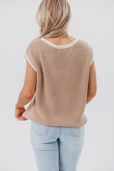 This is one of those must-have tops for dressing chic in warm weather. The Stella Sweater Vest Top features a charming, relaxed fit, paired with cap sleeves and contrast color binding; it's perfect for slipping on with linen pants, or pairing with your favorite denim. Best of all, it transitions beautifully between seasons! Available in two colorways. FIT: Runs true to size - relaxed fit. MATERIAL: 55% Acrylic, 45% Cotton. GARMENT DETAILS: Lightweight sweater knit top with a high rounded neckline, cap sleeves, and relaxed, boxy fit. Features rolled contrast binding. SIZE GUIDE: XS (0-2) / S (2-4) / M (6-8) / L (10-12) / XL (14-16) MODEL DETAILS: MISSES Mackenzie - Size S Heather - Size S Bust 34" 34" Waist 27.5" 27.5" Hips 40.5" 37.5" Height 5'7" 5'7" Soft Knit Sweater Vest For Spring Layering, Beige Crew Neck Sweater Vest For Spring, Spring Crew Neck Sweater Vest With Ribbed Neckline, Spring Sweater Vest With Ribbed Crew Neck, Knit Sweater Vest With Ribbed Neckline For Spring, Casual Knit Sweater Vest For Everyday, Ribbed Beige Sweater Vest For Spring, Neutral Knit Crew Neck Top, Beige Ribbed Sweater Vest For Spring