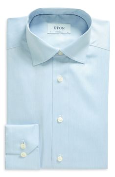 This handsome dress shirt cut from Eton's high-performance, crease-resistant fabric features a moderate spread collar and mitered, adjustable-button cuffs. Permanent collar stays French placket Back yoke Darts at the back to adjust the width Curved hem 100% cotton Dry clean or machine wash, dry flat Imported Men's Furnishings Light Blue Slim Fit Dress Shirt For Semi-formal Occasions, Light Blue Slim Fit Dress Shirt With Spread Collar, Light Blue Dress Shirt With Spread Collar, Light Blue Collared Dress Shirt For Business, Fitted Light Blue Dress Shirt With Button Closure, Fitted Light Blue Dress Shirt For Work, Light Blue Slim Fit Dress Shirt For Formal Occasions, Classic Light Blue Dress Shirt For Business, Formal Light Blue Slim Fit Dress Shirt