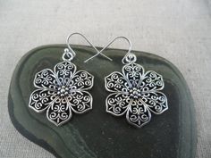 These are some gorgeous and fun flower earrings! They have incredible detail and dimension. Made from allergy free plated silver. The flowers Metal Flower Charm Earrings, Bohemian Hypoallergenic Flower Earrings, Nickel Free Flower Earrings As Gift, Silver Flower Earrings For Pierced Ears, Nickel Free Flower Shaped Earrings As Gift, Nickel-free Flower Earrings As Gift, Nickel-free Flower Shaped Earrings As Gift, Pierced Sterling Silver Flower Earrings, Metal Pierced Flower Earrings